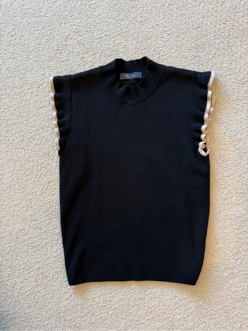 KLD Black Sleeveless Sweater with Cream Ruffle Trim